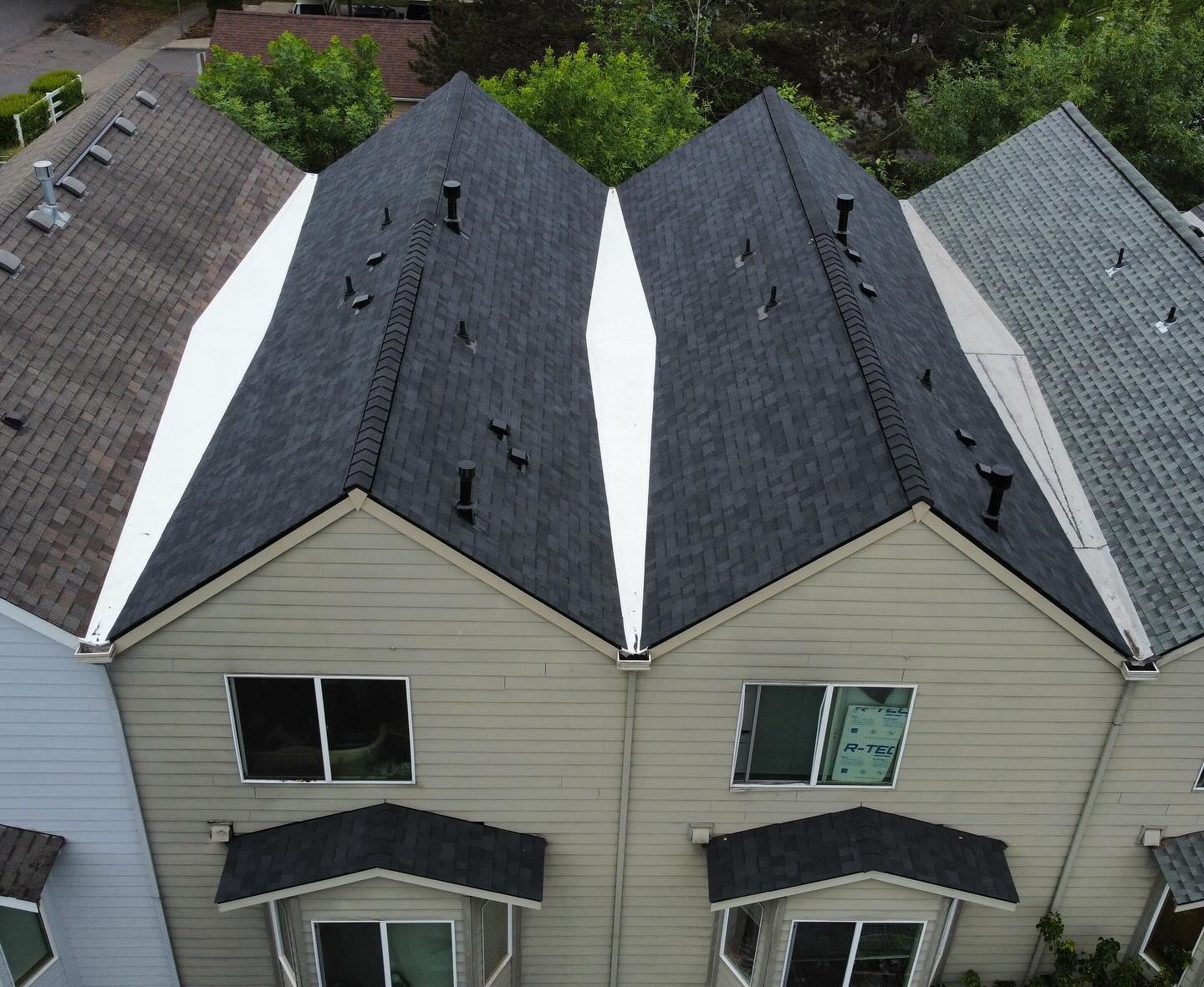 Close aerial detail of finished shingle ridge and valley work